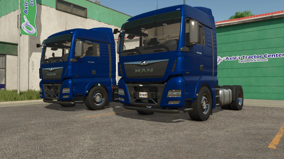 Blue MAN TGX 18500 trucks parked, featured in FS25 mods at Axle's Tractor Center.