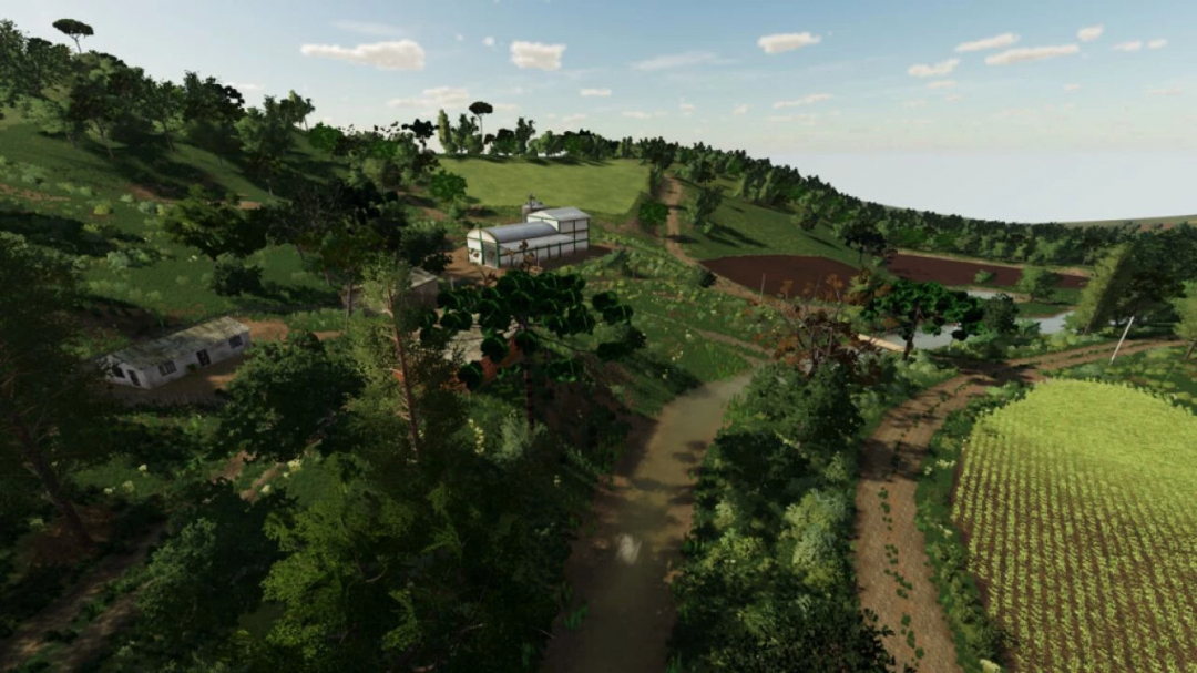 Scenic view of Rancho Fundo map in FS25 showcasing lush hills, a farmhouse, and fields.