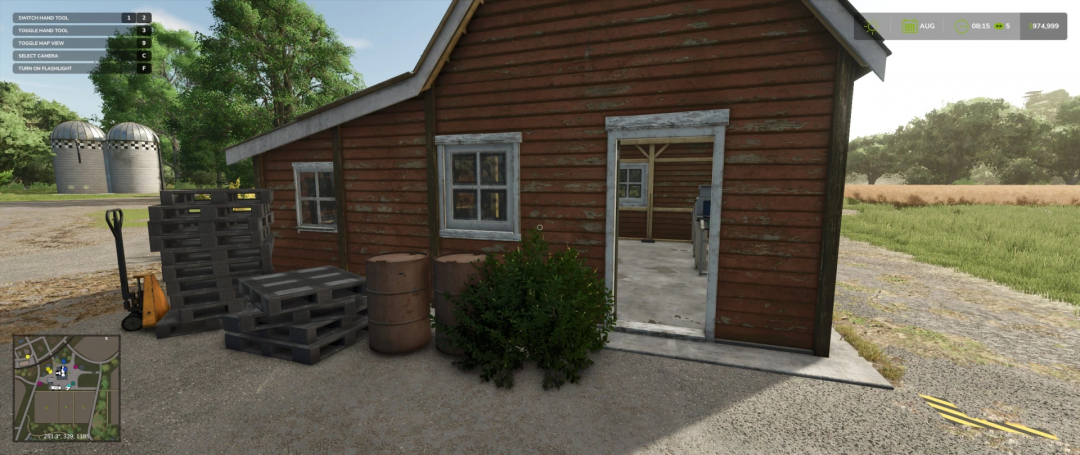 Small Food Production mod in Farming Simulator 25, showing a rustic building and pallets.