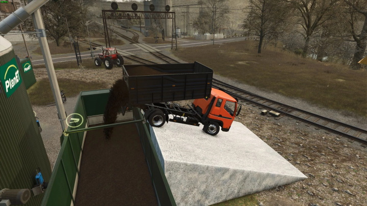 fs25-mods,  Truck unloading at BGA Ramp mod in FS25, near railway tracks.