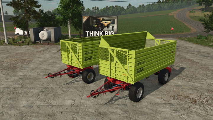 fs25-mods,  Two Fortschritt HW 80 Conow trailers in FS25 mod, parked on concrete, with greenery in background.