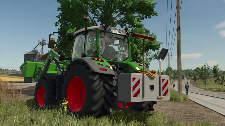 fs25-mods, FS25 mod Hof Weight v1.0.2.0 features a green tractor with a front-mounted weight in a rural setting.