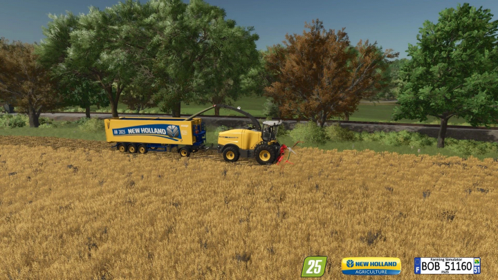 fs25-mods,  FS25 mod Katana New Holland v1.0.0.0 harvesting in a field with trees in the background.