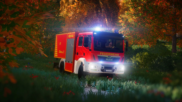 fs22-mods,  FS22 mod MAN GW L2 fire truck driving through autumn forest in Farming Simulator 22.