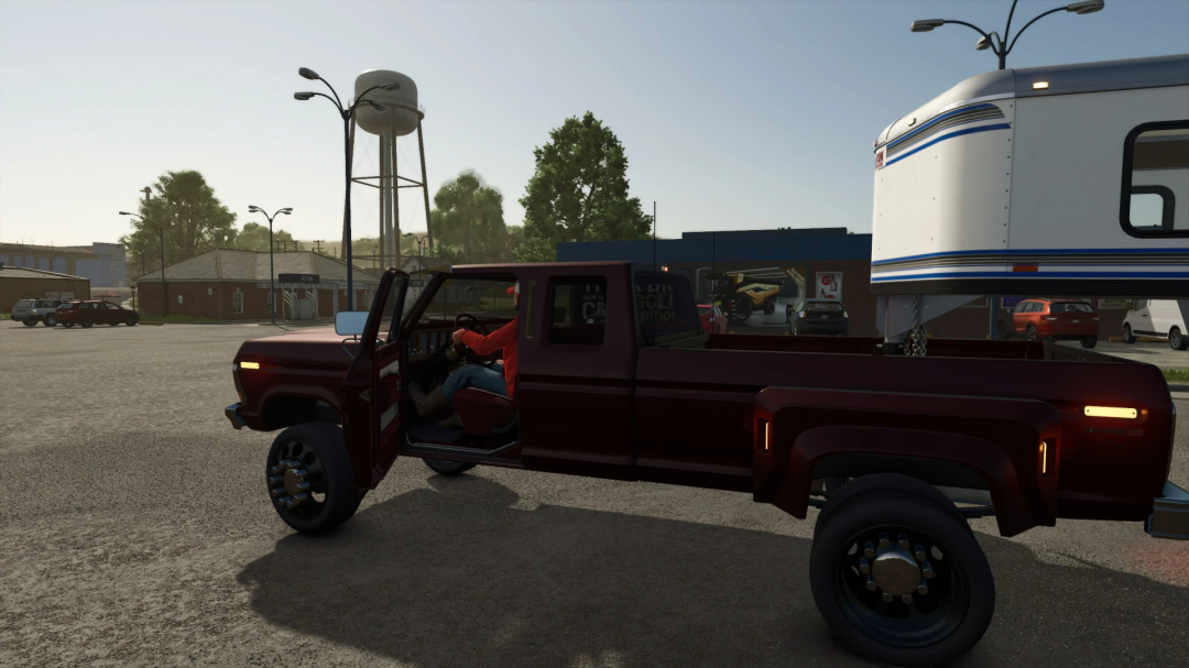 Red 78 Ford F350 mod in FS25 with driver and trailer in town setting