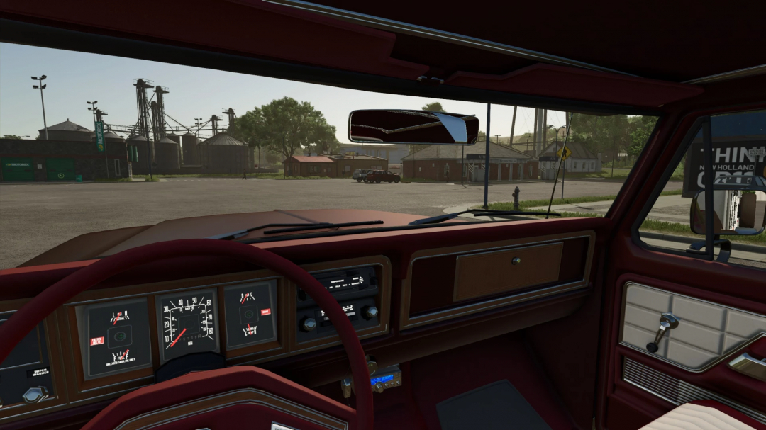 Interior view of 78 Ford F350 mod in FS25, showing dashboard details and exterior scenery.