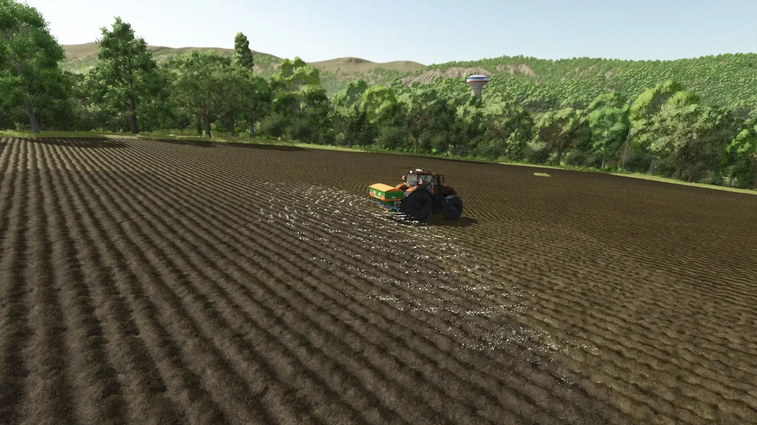 FS25 Amazone Seeder in field with green hills, using Seeder Spreaders Pack v1.0.0.0.