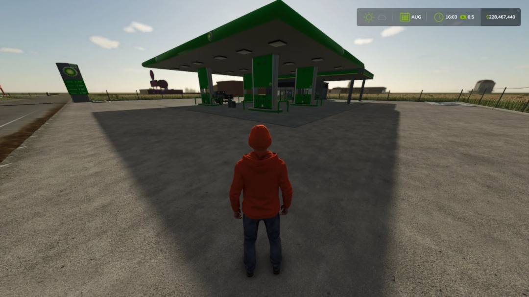 BP Gas Station mod in FS25, player stands facing green and white gas station under clear sky.