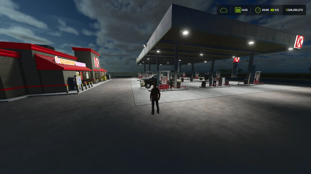 Circle K Gas Station in FS25 mod, featuring Dunkin' Donuts and fuel pumps, under night sky.