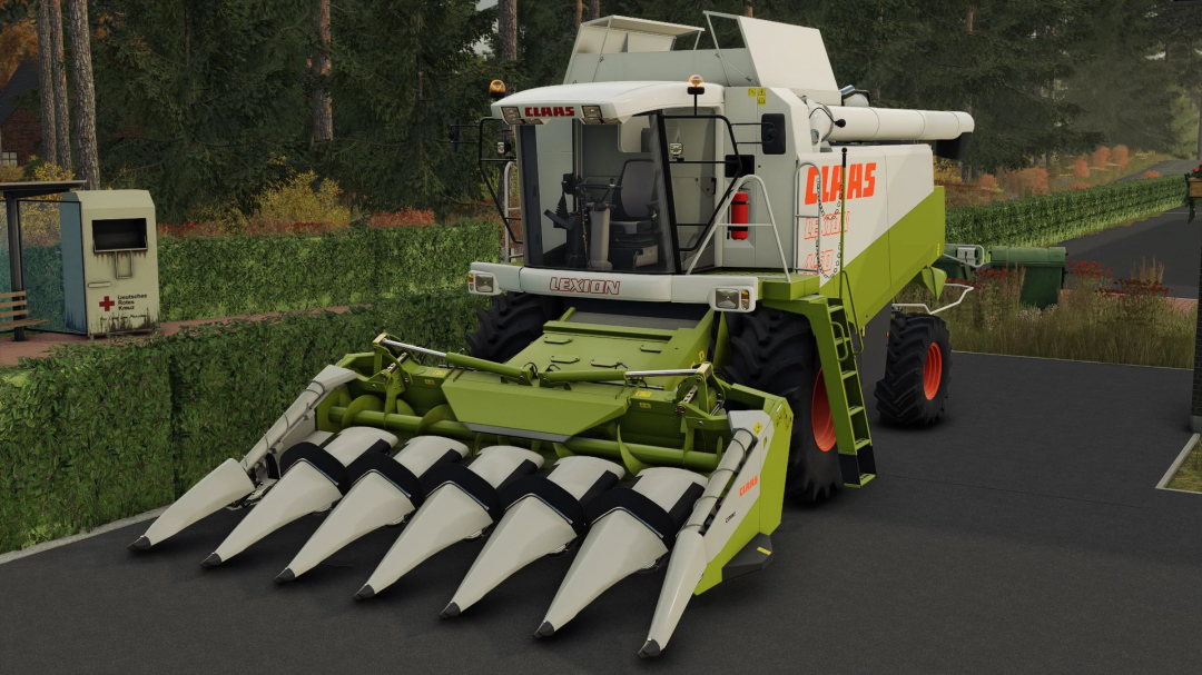 FS25 mod Claas Corio 675 FC v1.0.0.0 combines at rest on road surrounded by greenery.