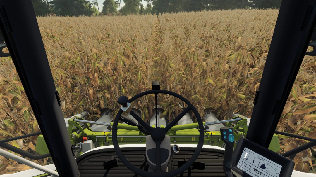 View from Claas Corio 675 FC harvester in FS25 mod, showing corn field from cockpit.