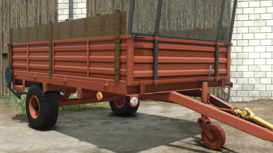 FS25 mod Agromet/Warfama N-250/1 trailer v1.0.0.0 for Farming Simulator 25, showcasing a red farm trailer against a barn backdrop.