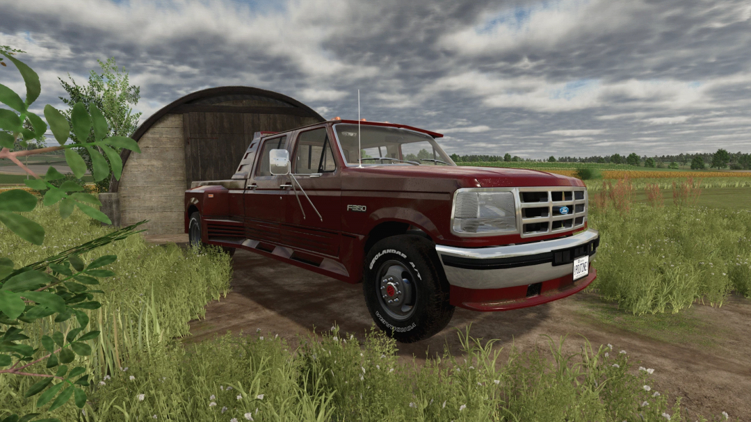 FS25 Ford obs truxarossa mod v1.0.0.0 in Farming Simulator 25 with red pickup truck parked in front of a barn.