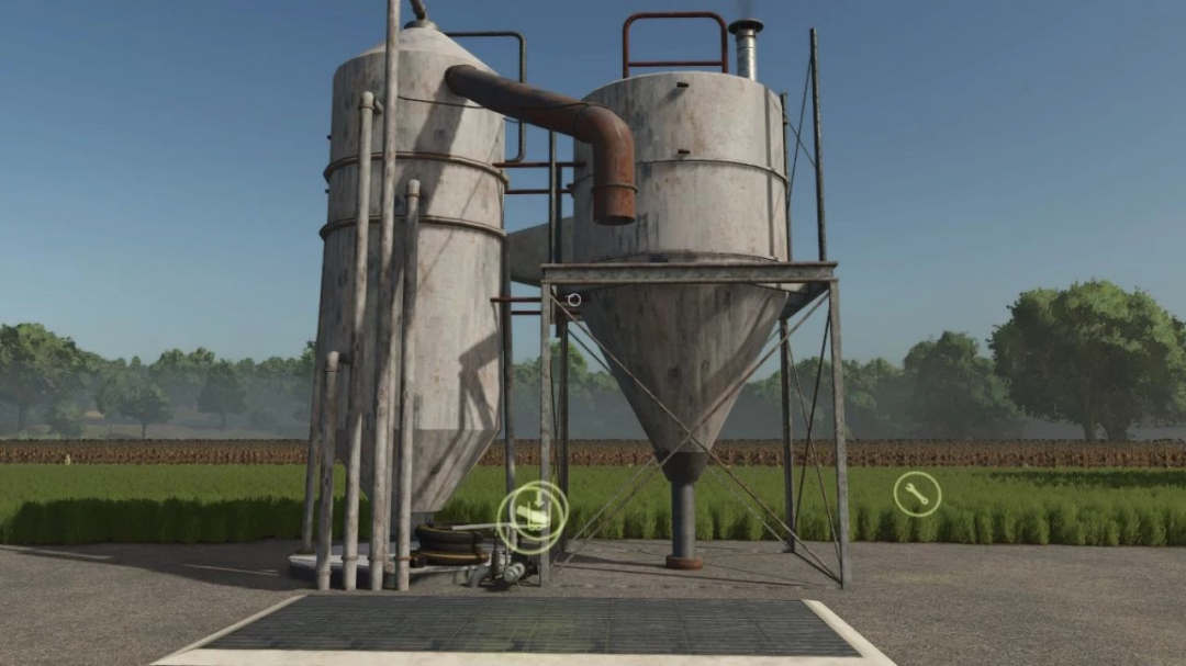 FS25 mods: fermenter, pig food, and TMR silos in a field. Mod version 1.6.0.5 in Farming Simulator 25.