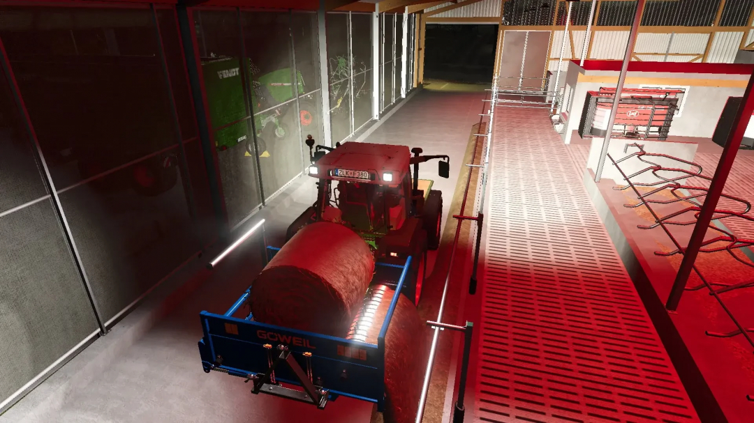 FS25 mod Göweil RBA bale shredder in use inside a barn, showcasing bale processing equipment.