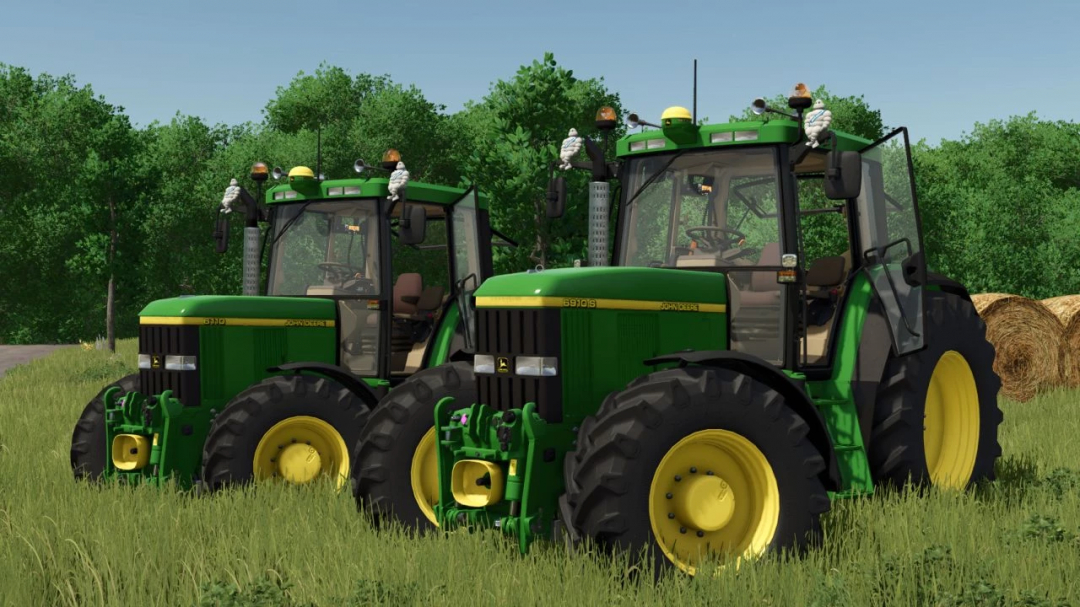 Two John Deere 6x10 tractors in a grassy field from FS25 mods.