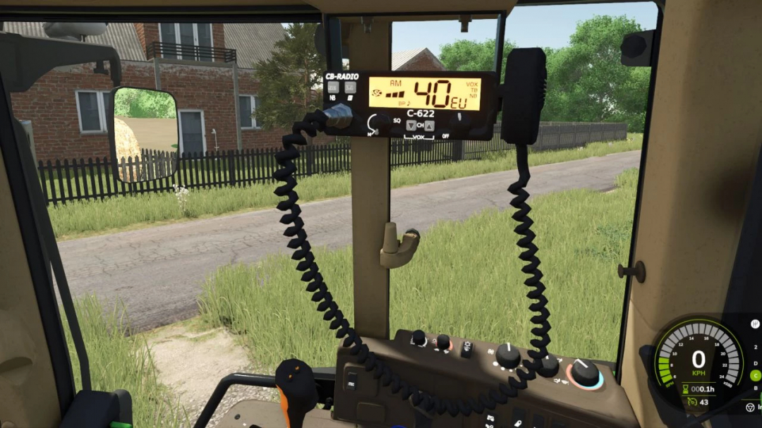 Inside view of John Deere 6x10 Series mod in FS25, showing dashboard and radio controls.