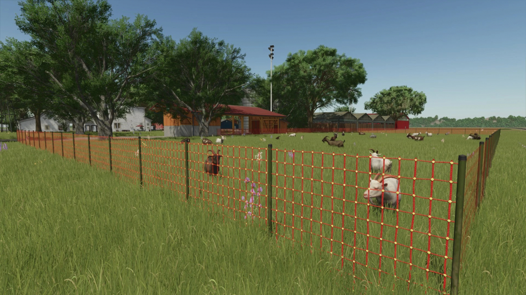 FS25 mod Legacy Township v1.0.0.0 showcasing goats in a fenced pasture with barns and greenery.