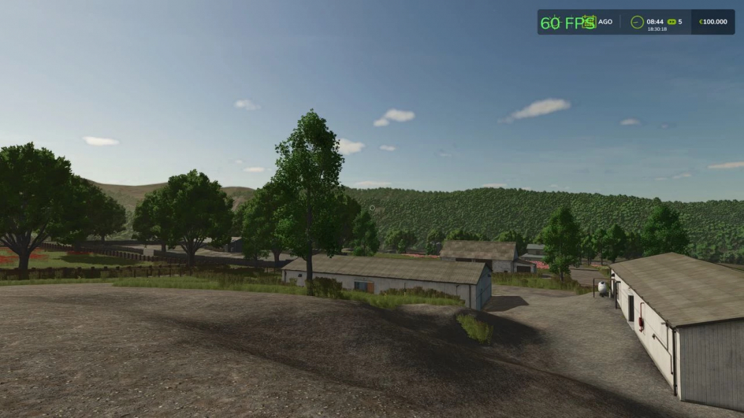 Scenic farm landscape in FS25 mod Terenurile nimanui v1.0.0.0 with trees and barns.