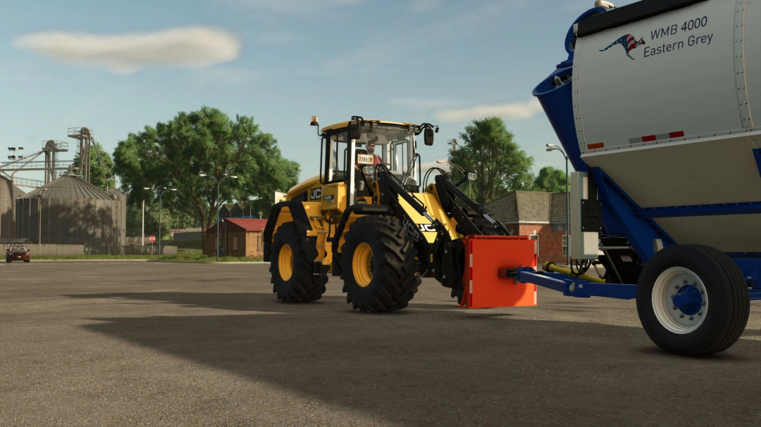 FS25 mod Trailer Adapter v1.0.0.0 connects a yellow tractor to a blue WMB 4000 trailer.