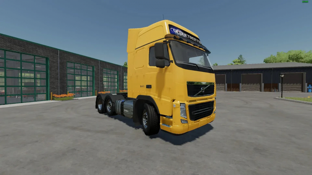 FS22 Volvo FH3 6x2 mod in Farming Simulator 22 shows a yellow truck in a garage setting.