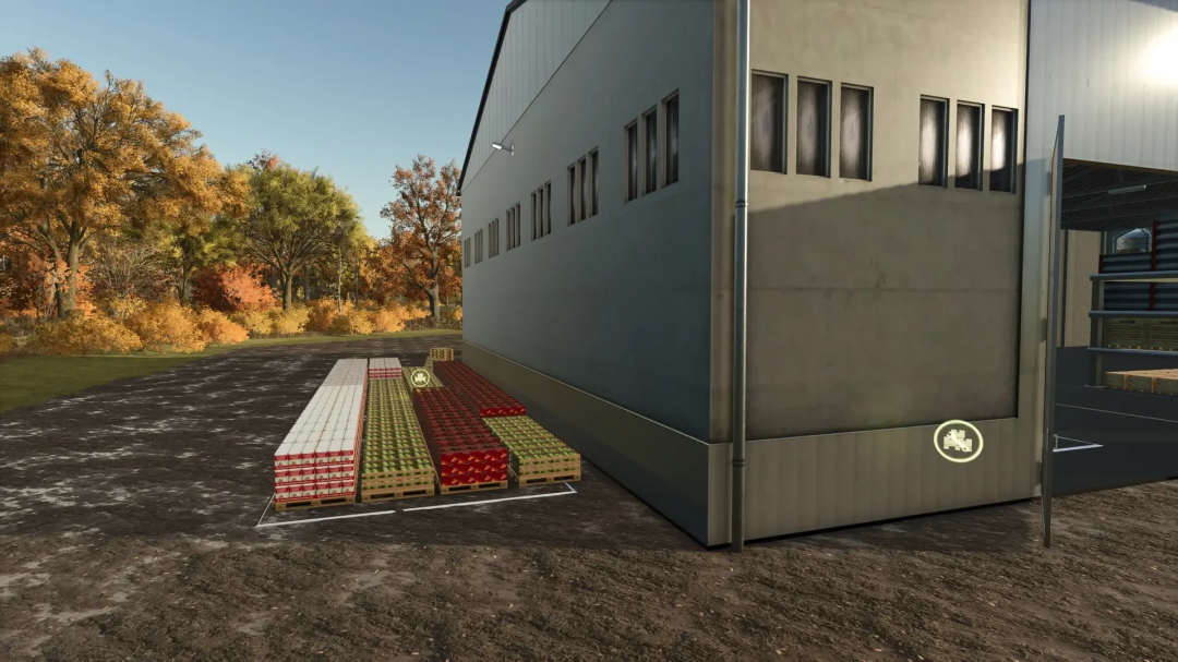 FS25 mod WobbyTec Drive-In v1.0.0.1 showing a building with pallets outside in an autumn setting.