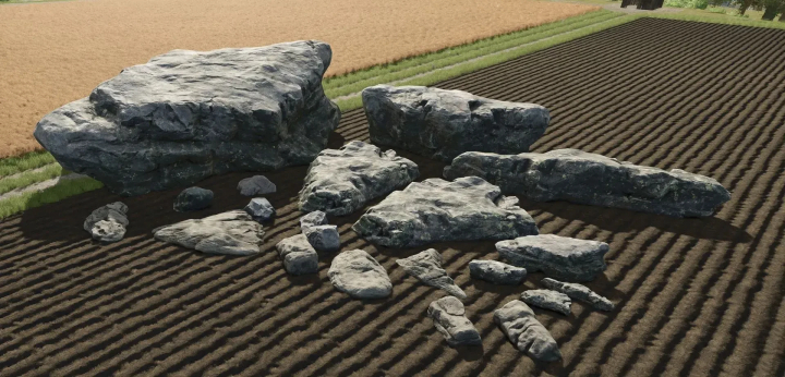 fs25-mods,  Decorative rocks from FS25 Decorative Stone/Rock Package mod displayed in a plowed field.