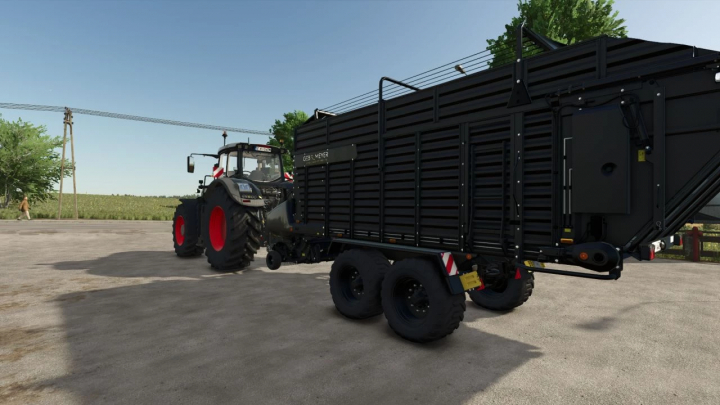 fs25-mods,  FS25 mod: Flex trailer Gebr.Meyer v1.0.0.0 attached to a tractor on a sunny farmyard.