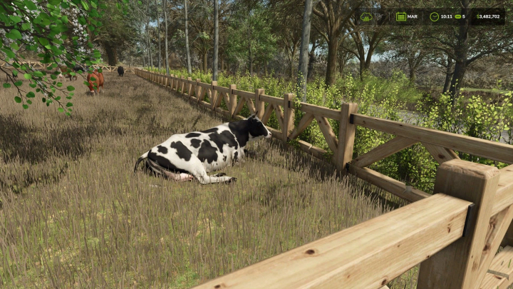 fs25-mods,  Small cow pasture with wooden fences in FS25 mod featuring lush greenery and a black and white cow resting.