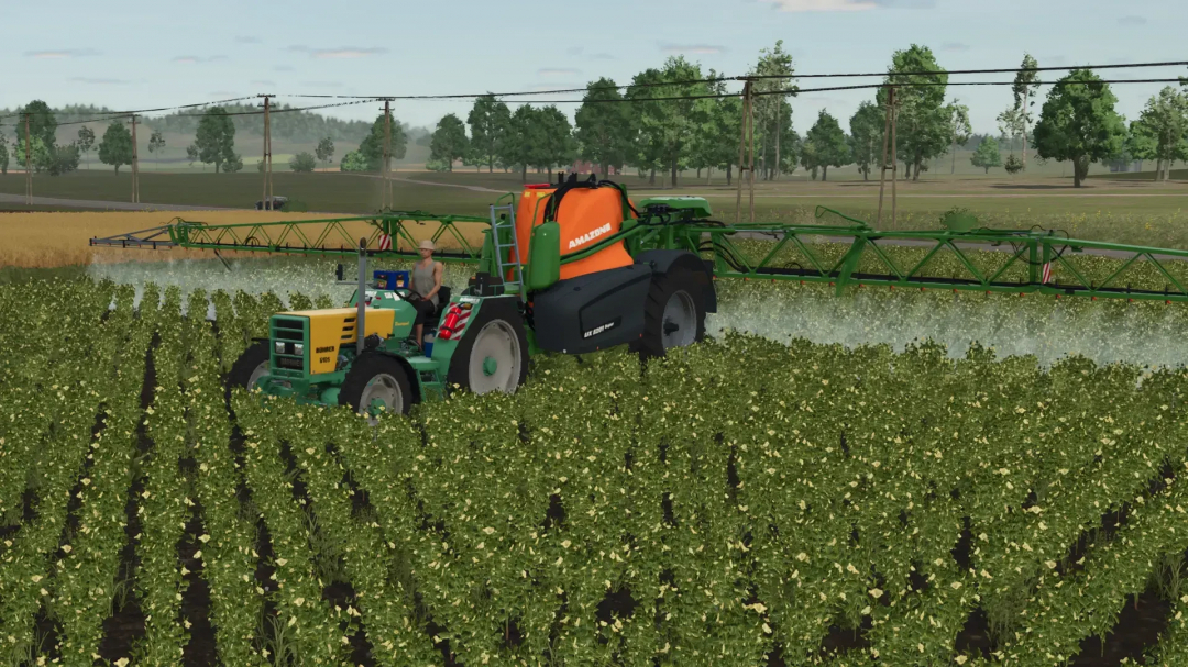 FS25 mod Bührer 6105 Series spraying crops in a field