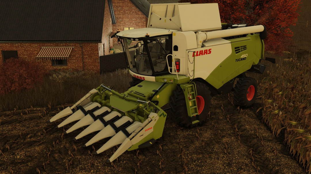 Claas Tucano 450 harvester mod in FS25, parked on a field beside a brick house.