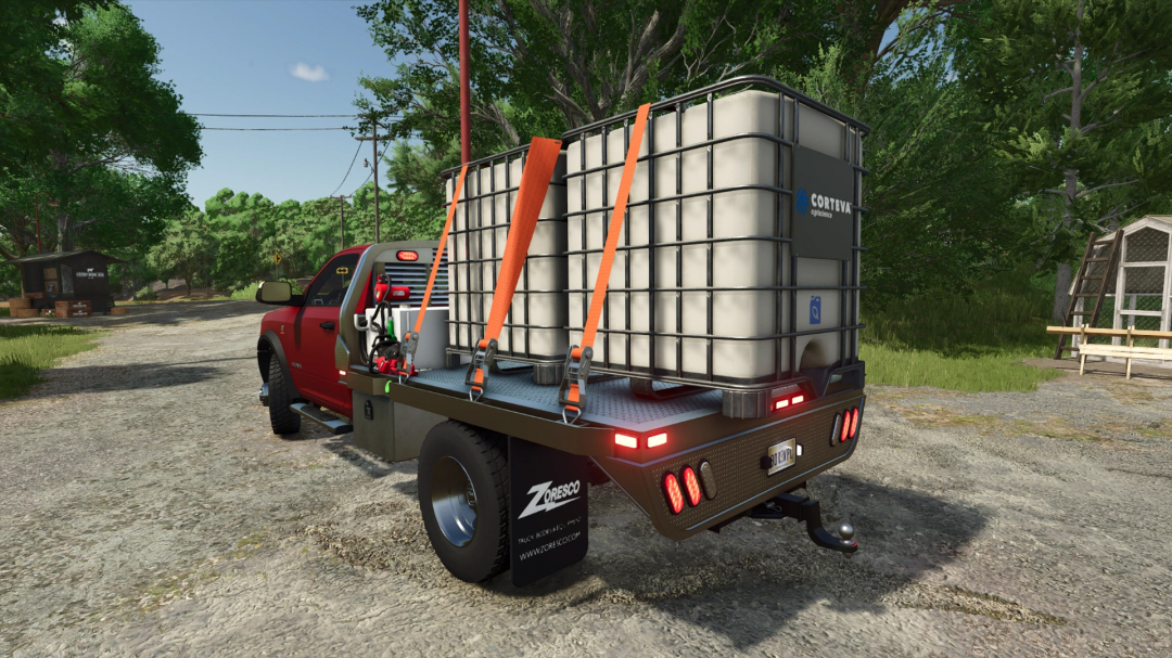 FS25 Dodge Ram 5500 v1.4.0.0 mod, featuring a red truck loaded with large containers, set in a rural environment.