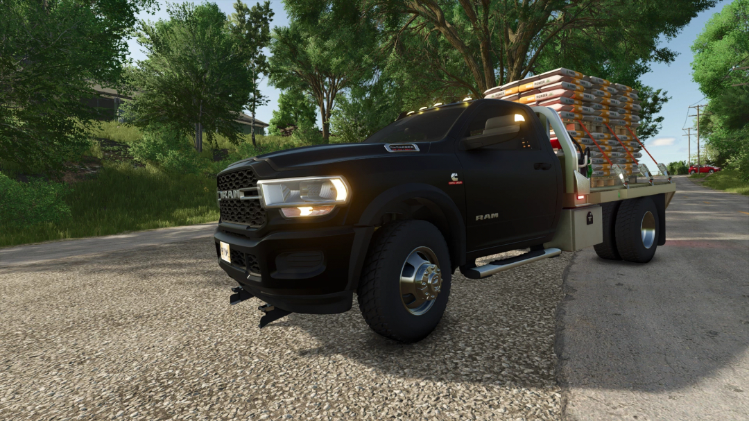 FS25 mod Dodge Ram 5500 v1.4.0.0 with cargo on rural road in Farming Simulator 25.