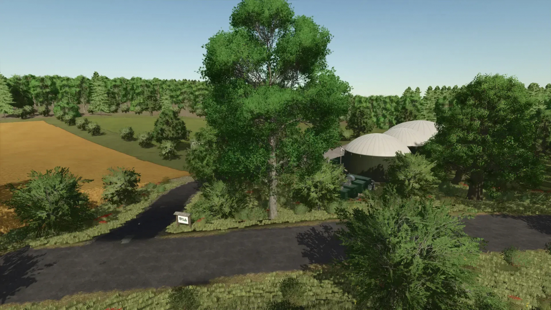 Scenic farm landscape in FS25 mod FBM25 Sonnental, featuring fields, trees, and a biogas plant.