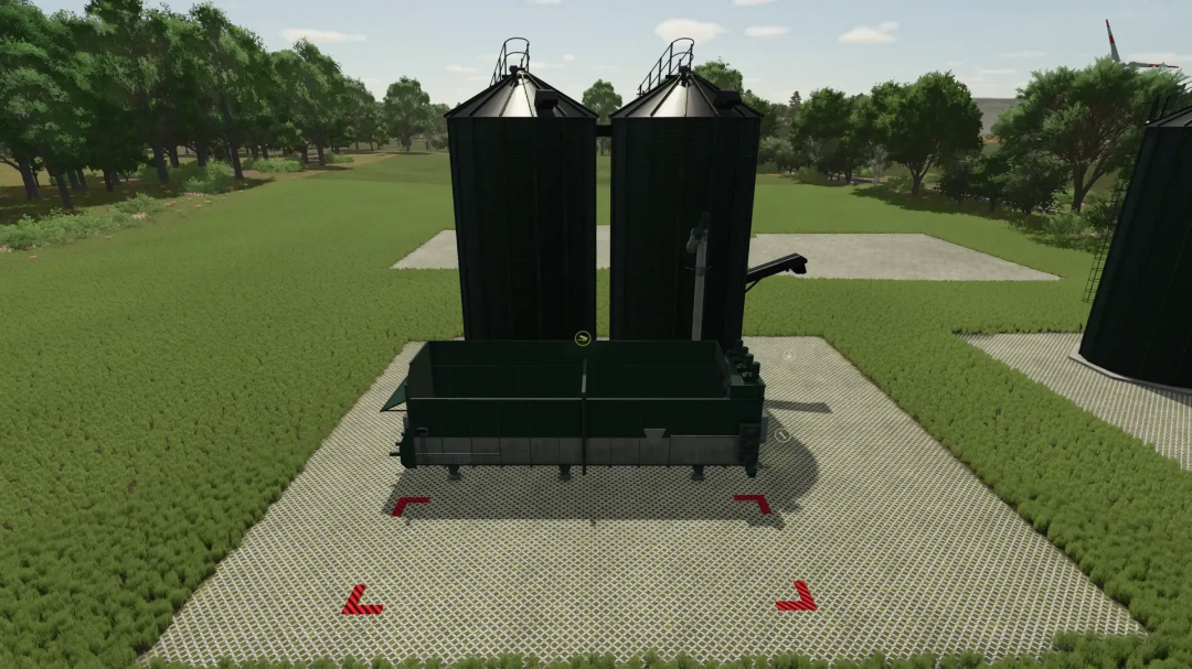 FS25 mod Feed mixer v1.0.0.0 in a green field setting, showcasing twin silos for efficient farming processes in Farming Simulator 25.