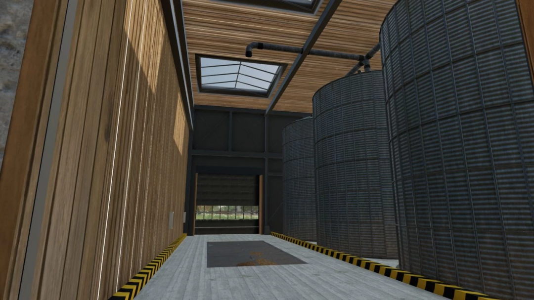 Interior view of Holzwurm Manni Hall mod in FS25, featuring wooden walls and large silo tanks.