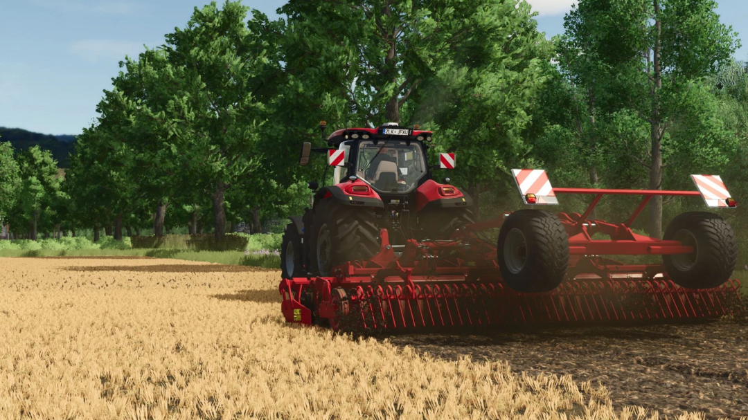 FS25 mod Horsch Joker 6 RT v1.0.0.0 in a field, showing a red tractor with a disc harrow, trees in the background.