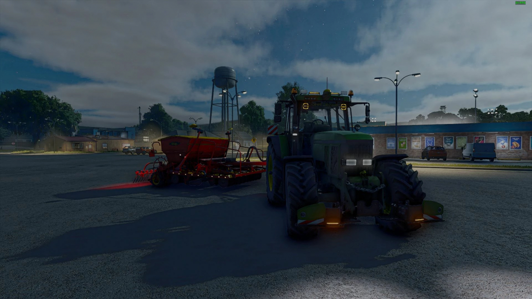 John Deere 7810 tractor with seeder in FS25 mod at dusk, illuminated by streetlights.