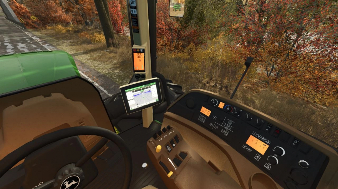 Interior view of John Deere 9620/9630 mod in FS25, showing dashboard and steering wheel with autumn foliage outside.