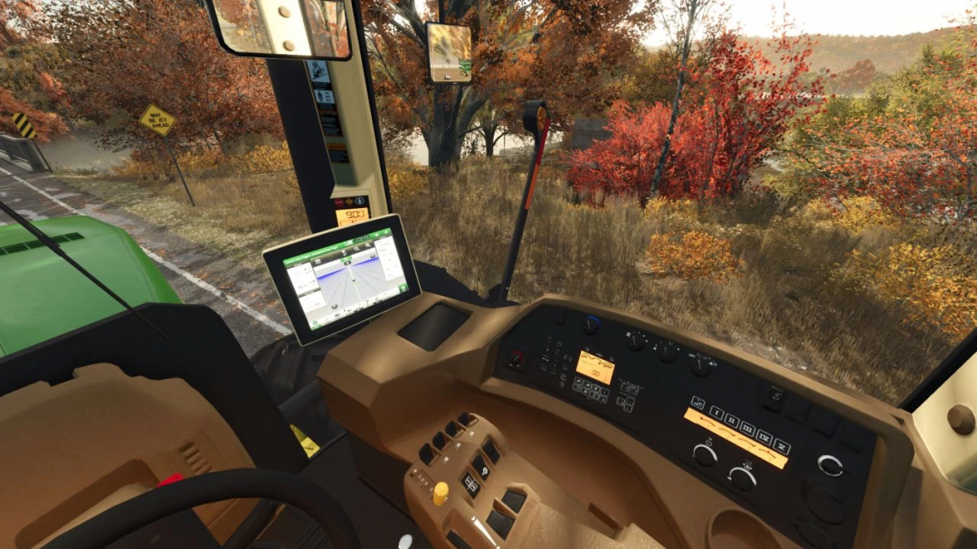 View from inside a John Deere 9620/9630 tractor mod in FS25, showing the dashboard and autumn scenery.