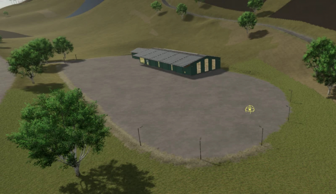 FS25 mod Kaprun v2.1.2.0: a large, empty paved area with a green warehouse amid a hilly landscape in Farming Simulator 25.