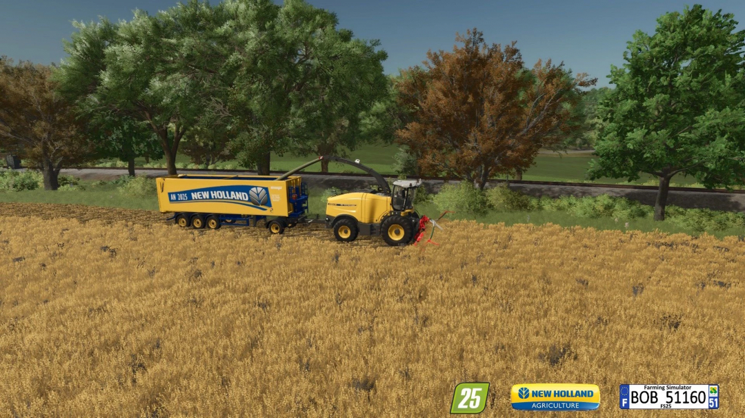 FS25 mod: Sks 30/150 New Holland in a field, showing a yellow harvester and trailer, set against a backdrop of trees.