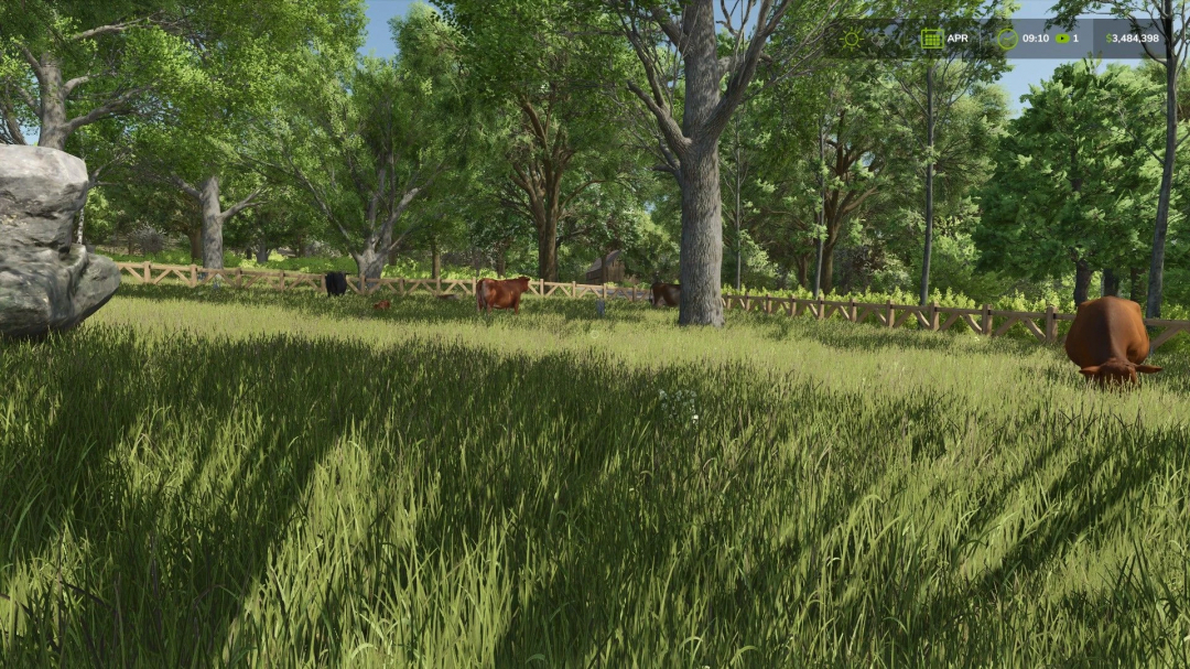 Small Cow Pasture in FS25 with wooden fences and lush greenery.