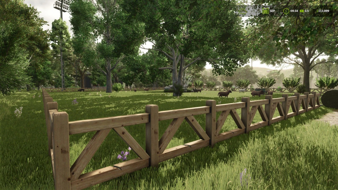 Small Sheep & Goat Pasture with a wooden fence in FS25 mod. Grazing animals amid lush trees and grass.