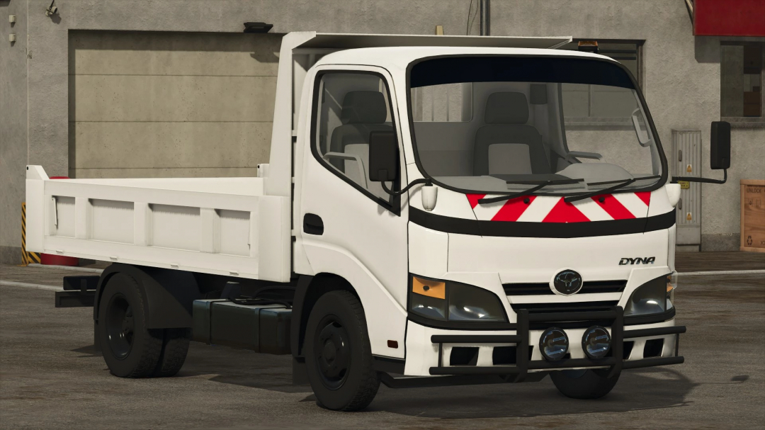 Toyota Dyna truck in FS25 mod pack, featuring a white body and industrial environment. Ideal for Farming Simulator 25 gameplay.