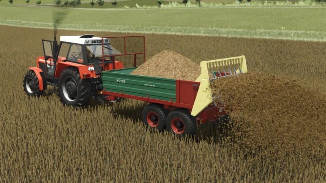 FS25 mod Warfama N218 spreading materials in a field with a tractor.