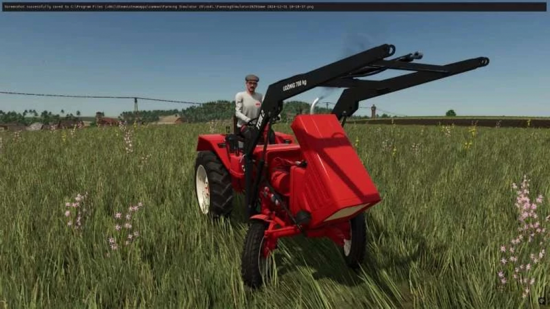 Wlademirec t25 v1.1.0.1 mod in Farming Simulator 25, showcasing a red tractor in a grassy field.