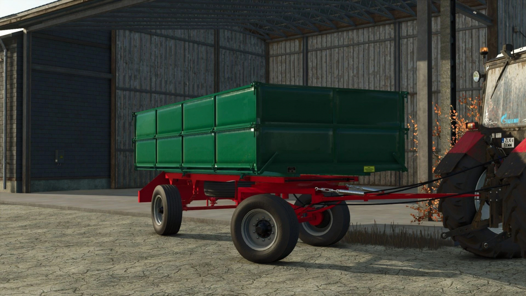 Zmaj 489 trailer mod in Farming Simulator 25, featuring a green container and red chassis next to a tractor.