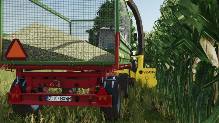 fs25-mods,  FS25 mod Celikel v1.0.0.0 showing a trailer harvesting corn in Farming Simulator 25.