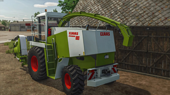 fs25-mods, FS25 mod: Claas Jaguar 800 forage harvester in Farming Simulator 25, parked near a barn.